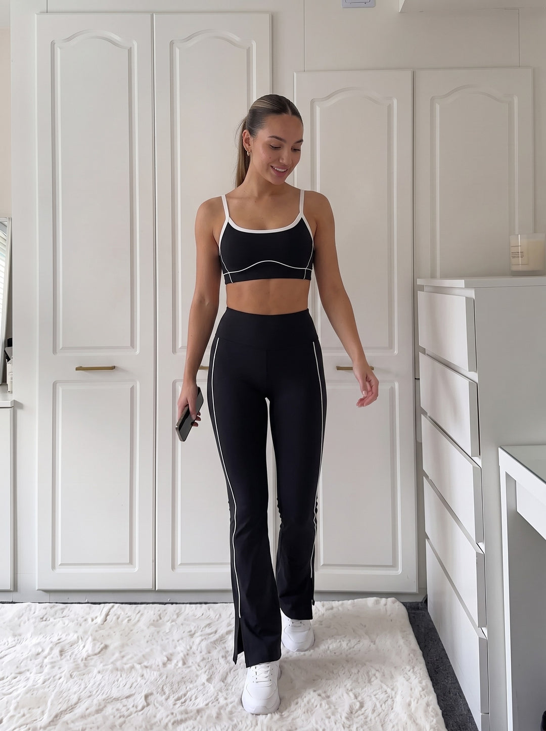Barbara black sports bra and flared leggings set with white contrast trim