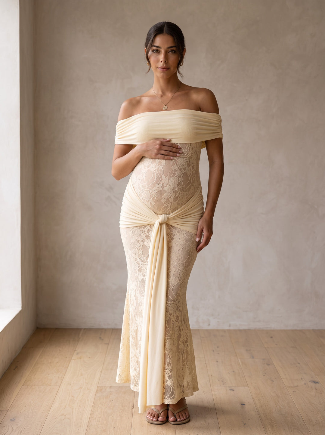 Bindi cream off-the-shoulder lace maternity maxi dress with ruched sash under the bump, front view