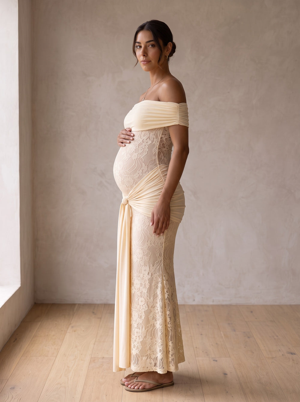 Bindi cream off-the-shoulder lace maternity maxi dress with ruched sash under the bump, front view