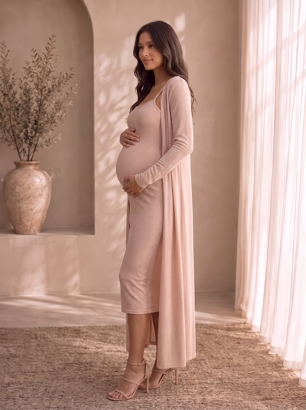 Camilla blush pink shimmer bodycon midi dress with spaghetti straps and matching open-front duster cardigan, front view