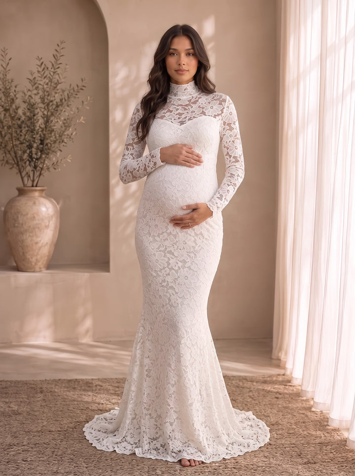 Colette white lace maternity maxi dress with mock neck, sheer lace yoke and long lace sleeves, front view