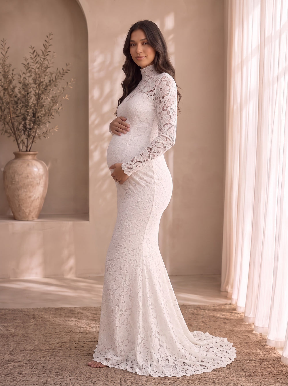 Colette white lace maternity maxi dress with mock neck, sheer lace yoke and long lace sleeves, front view
