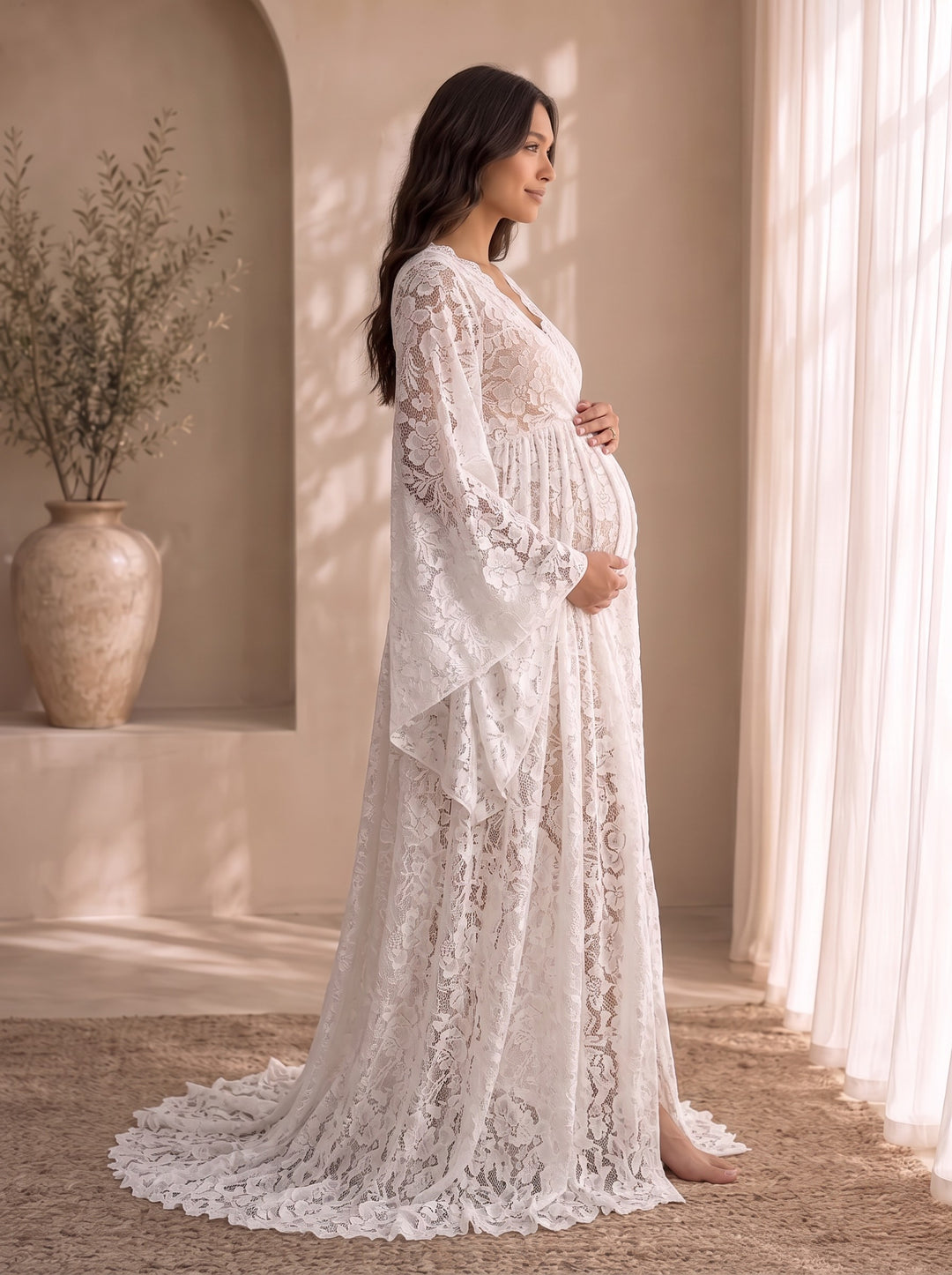 Mariposa lace maternity gown, side profile with wide bell sleeves and floor-length train
