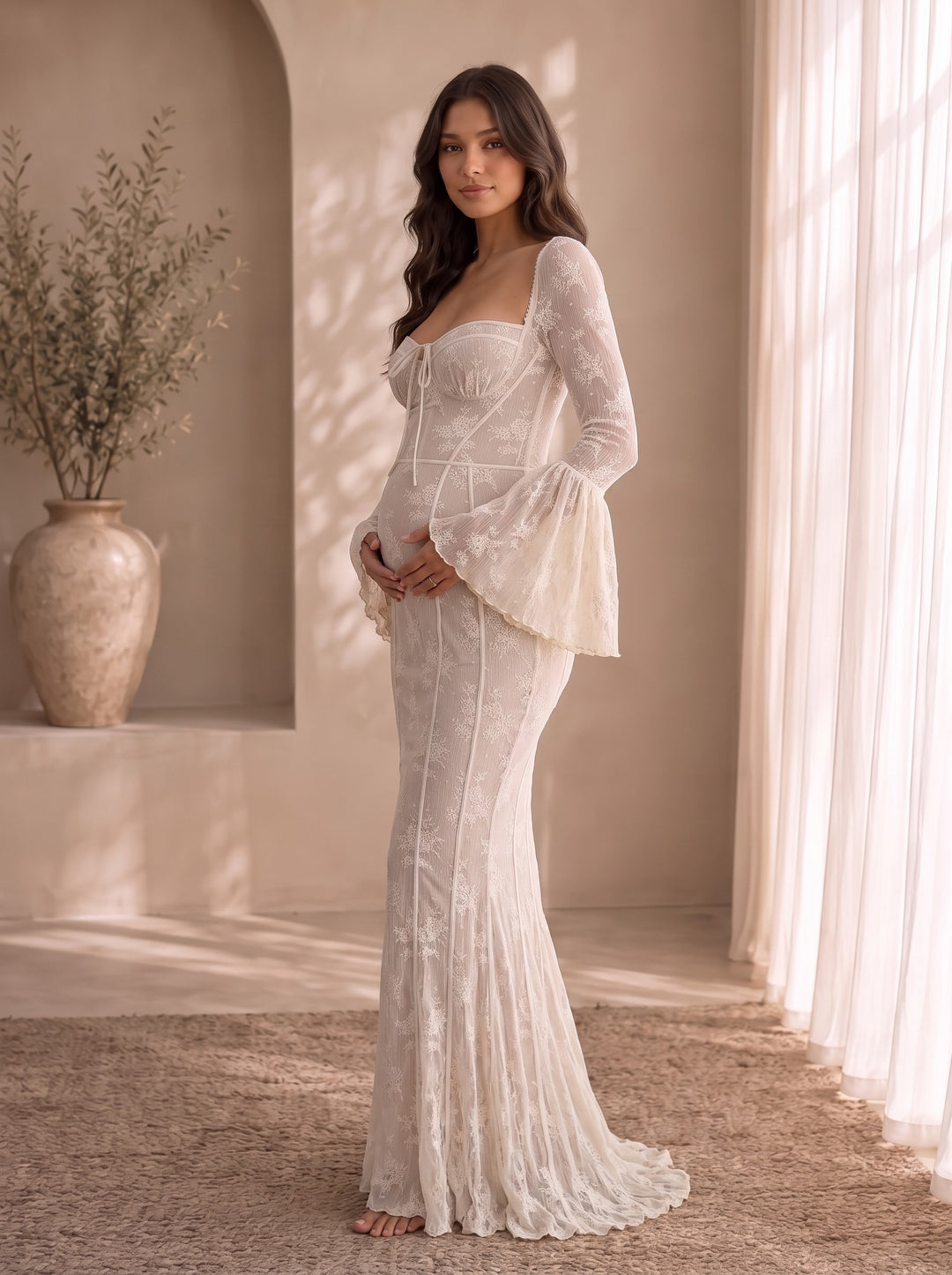Matilda lace maternity maxi dress, side view showing the fitted body over the bump and fishtail hem